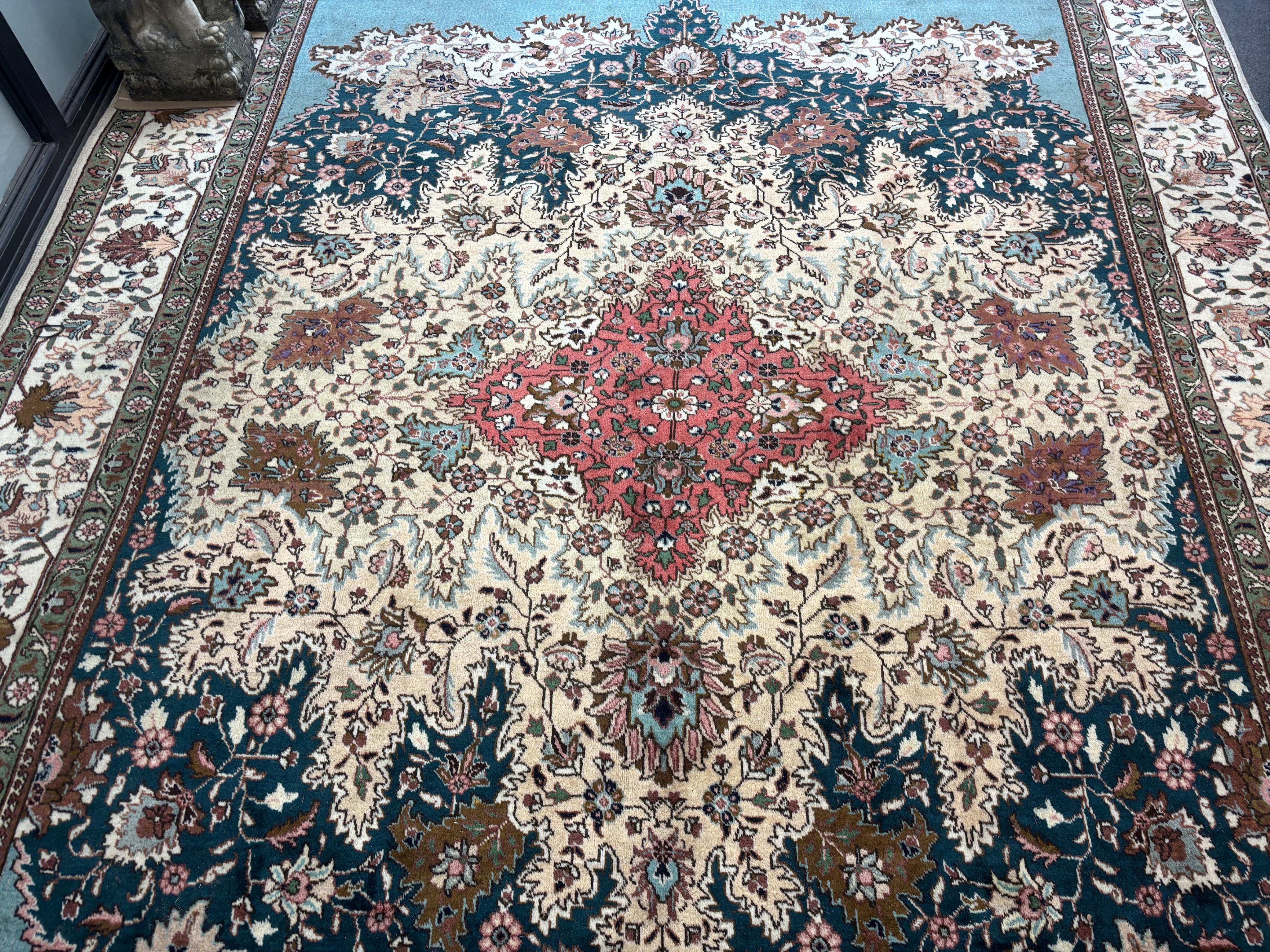 A Tabriz carpet, 400 x 310cm